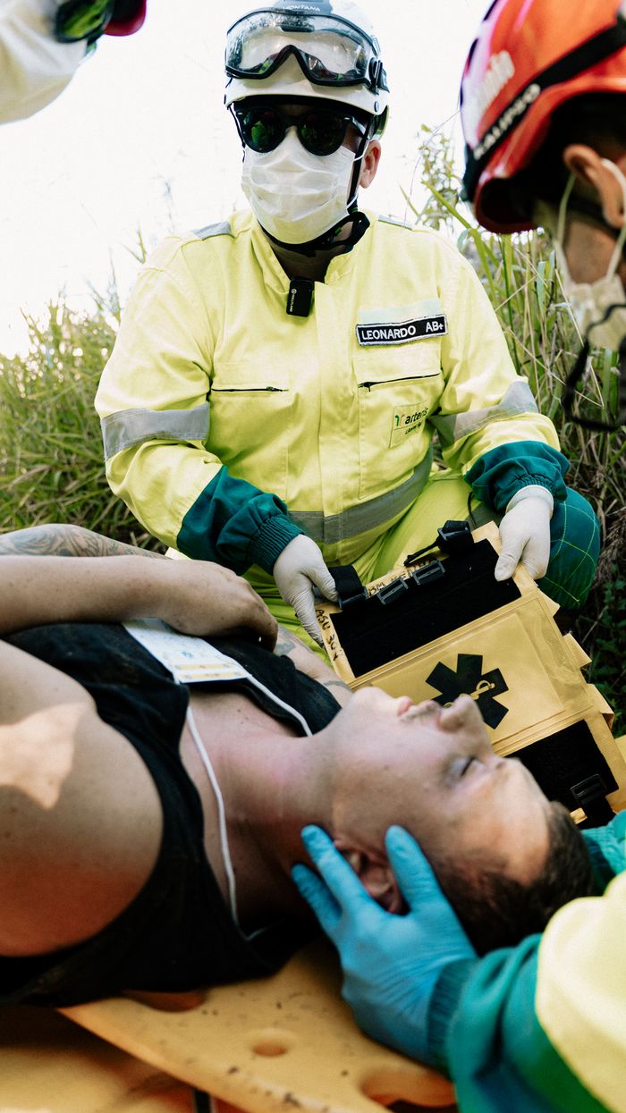 Mastering the First Impression: Your intriguing post title goes here Emergency responders in action assisting a patient outdoors during a medical simulation.